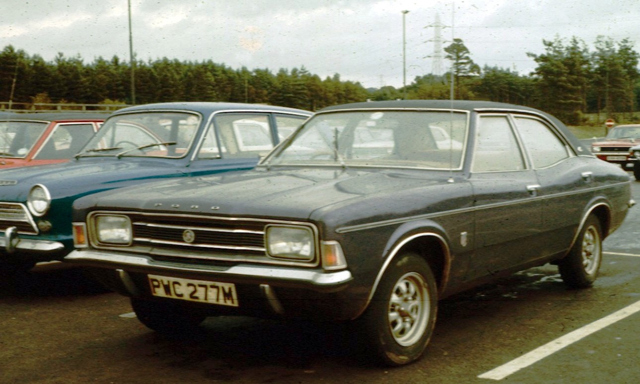 Ford Cortina Mk3 2000E executive saloon in England 1973, showing the post-facelift Coke-bottle styling