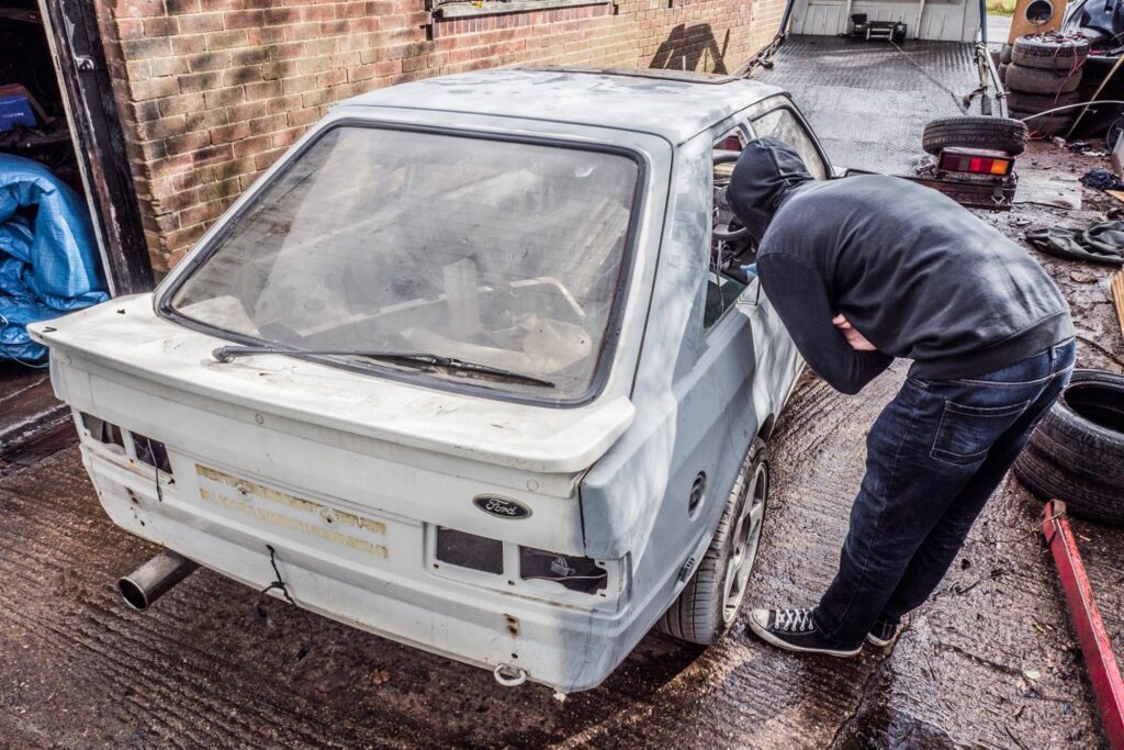 Classic car being sanded and prepped for paint in the workshop at Top Touch Coachworks near Milton Keynes