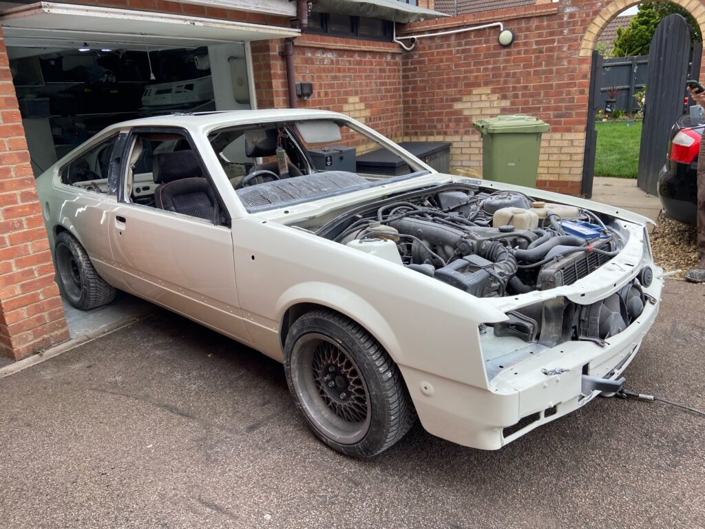 Ford Escort RS Cosworth in primer being prepped in the workshop at Top Touch Coachworks near Milton Keynes