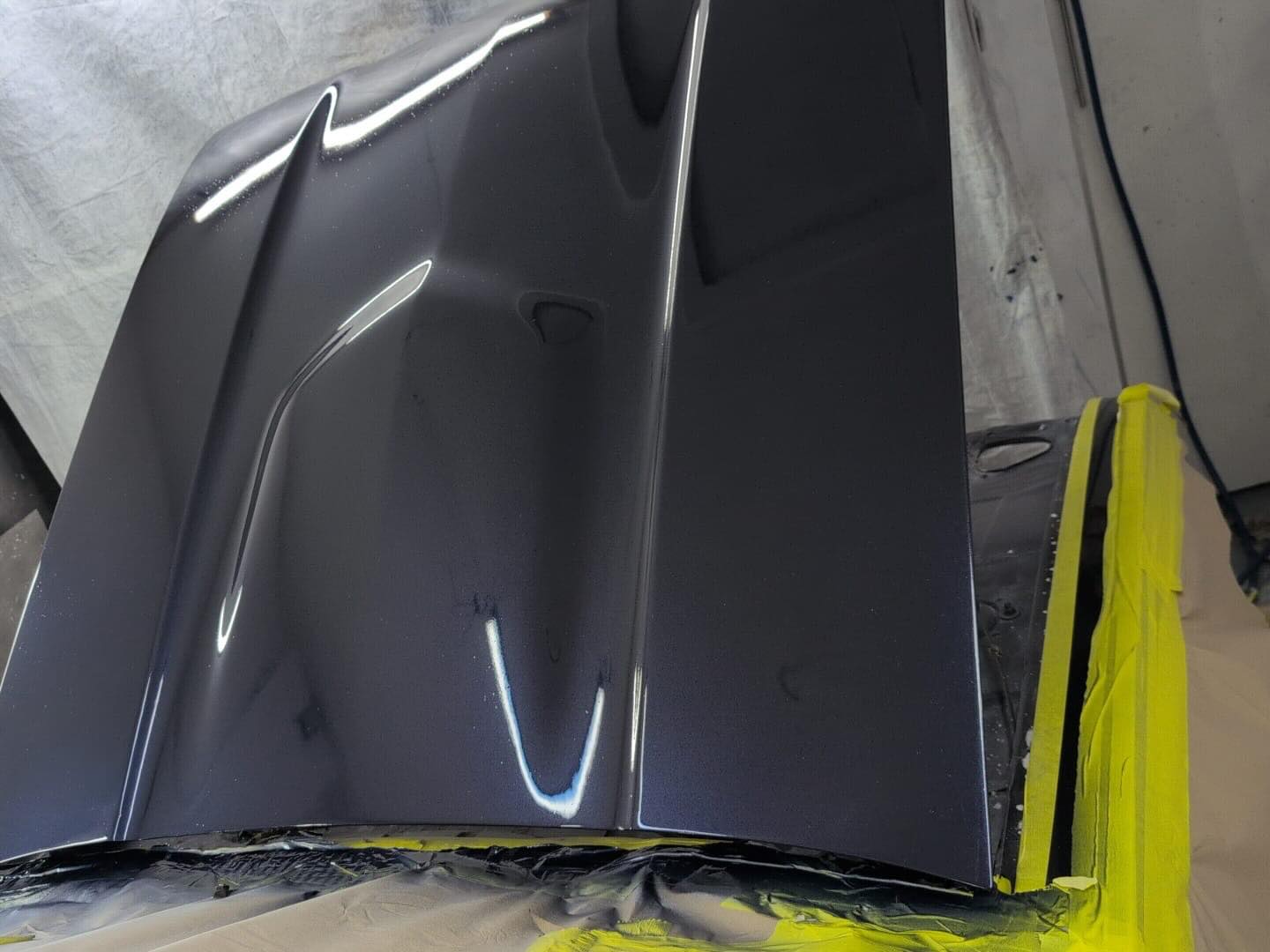 Ford Capri Brooklands replacement bonnet freshly sprayed in custom VW blue metallic in the spray booth