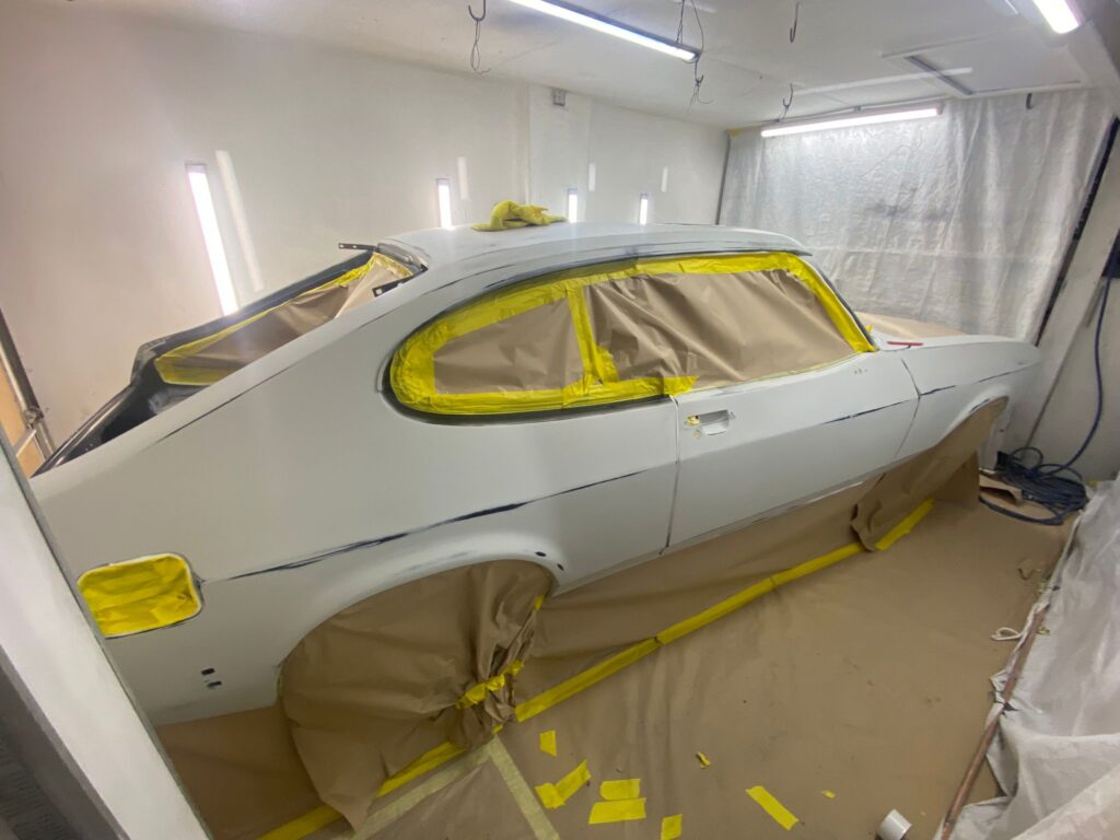 Ford Capri masked and primered in spray booth at Top Touch Coachworks