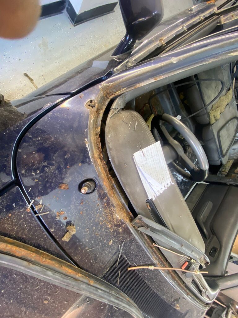 Rust damage around Ford Capri windscreen before repair, classic car restoration near Milton Keynes