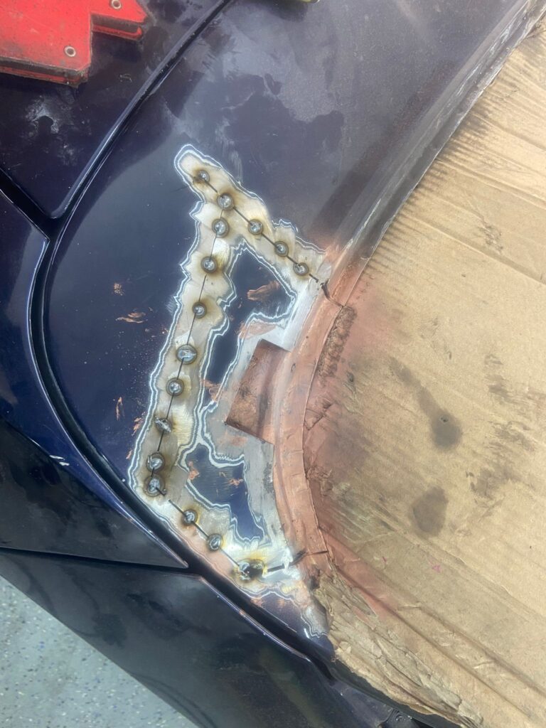 Welding patch repair on Ford Capri body panel, fabrication by Top Touch Coachworks