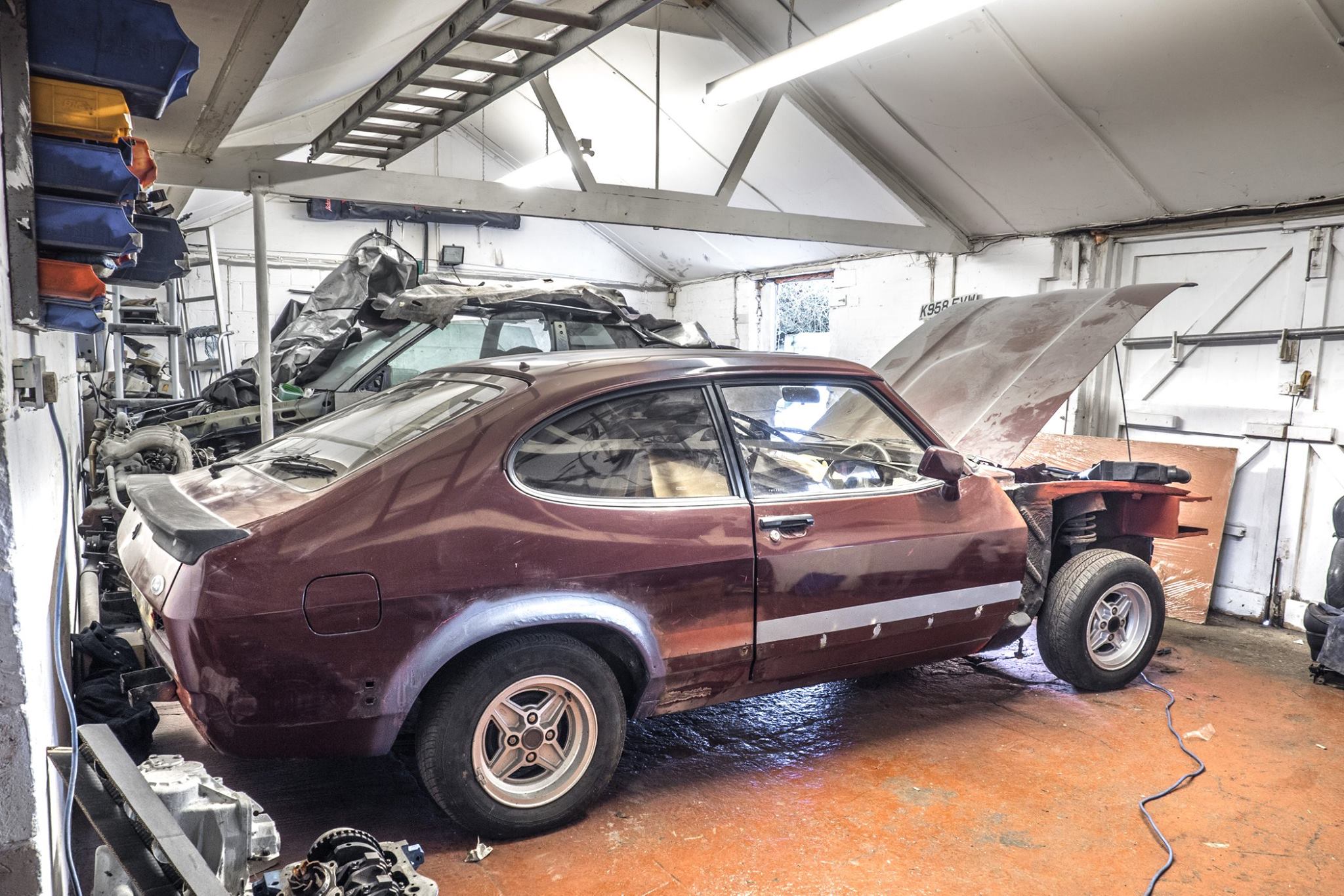 Ford Capri Brooklands mid-restoration in workshop — panels stripped and bodywork in progress