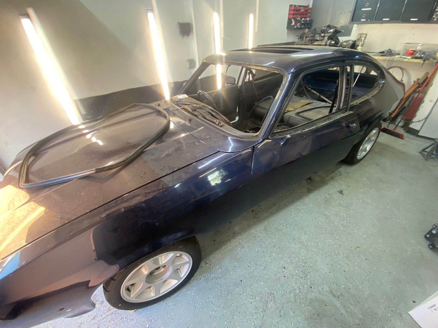 Ford Capri 2.8i shell stripped for restoration in Top Touch Coachworks workshop