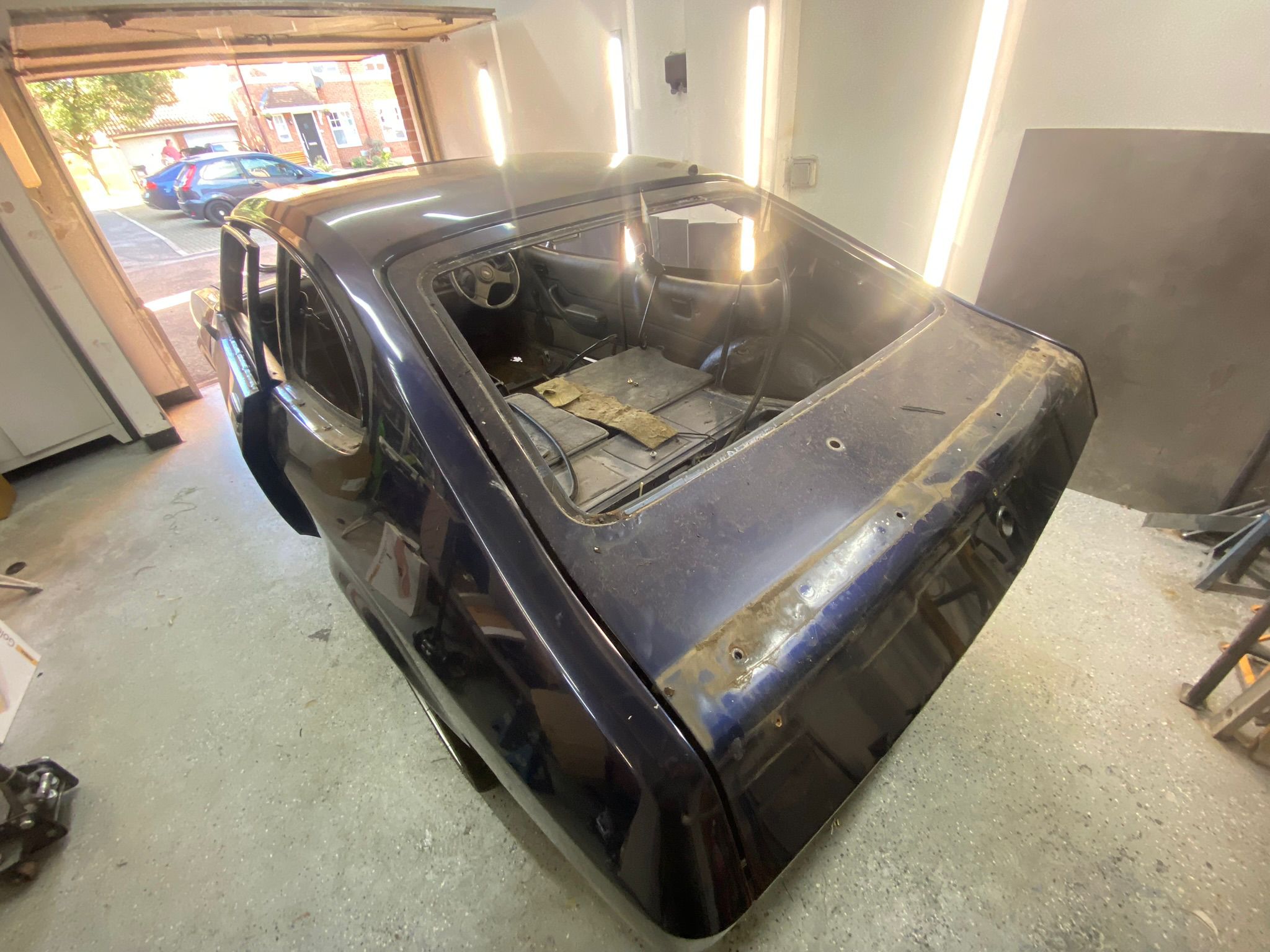 1986 Ford Capri Brooklands rear three-quarter view stripped in workshop during full restoration