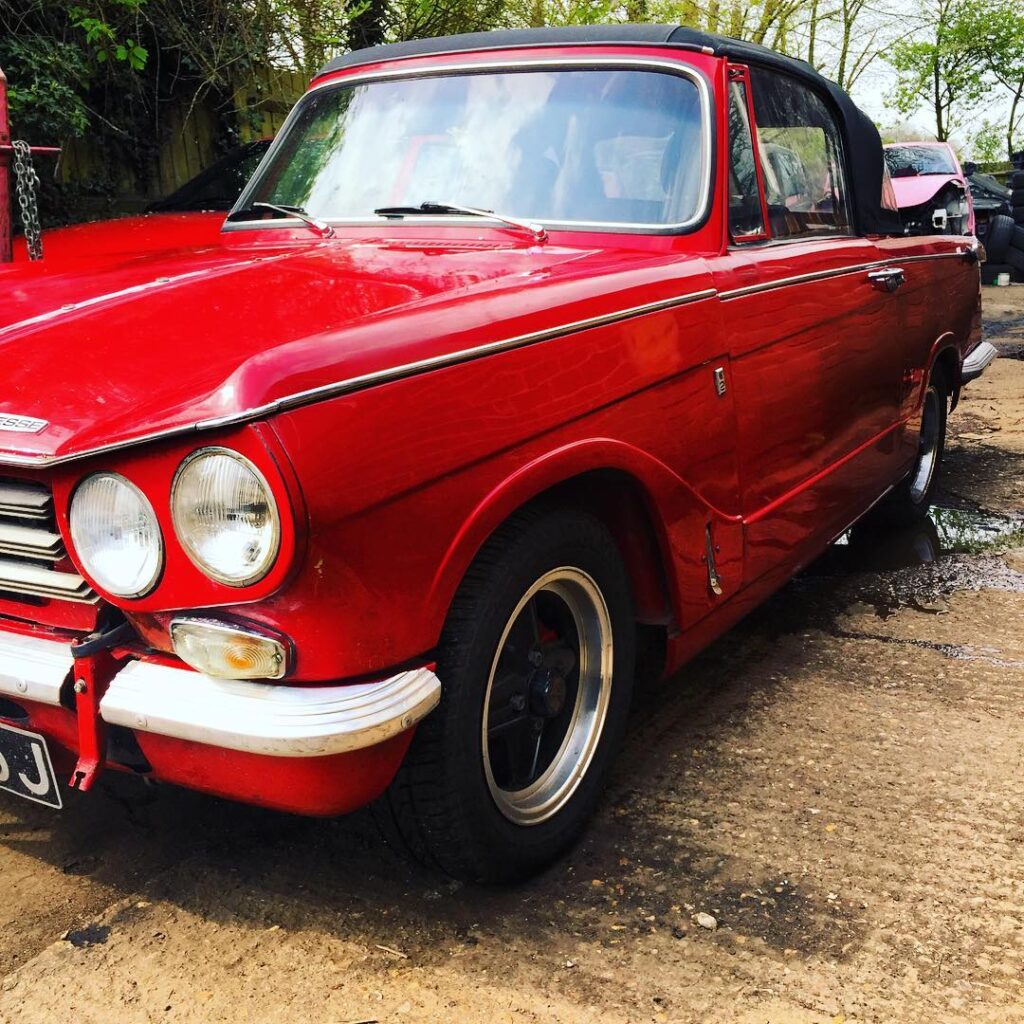 Classic red Triumph at Top Touch Coachworks, classic car restoration near Buckingham