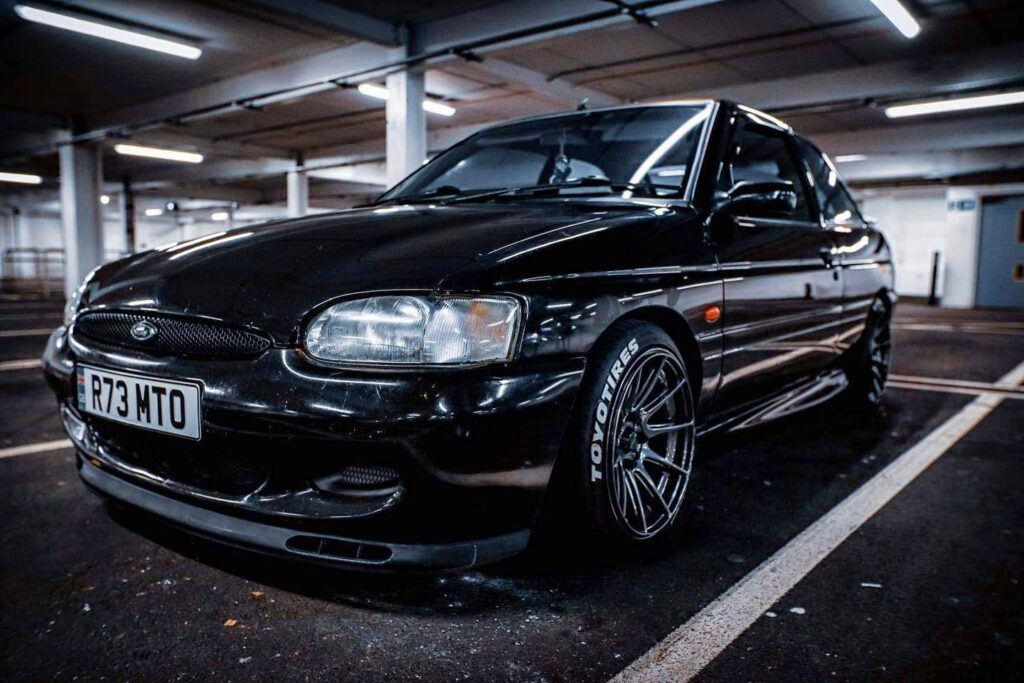 Ford Escort GTI in underground car park, glossy black respray by Top Touch Coachworks