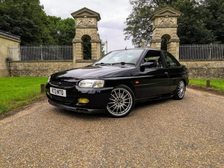Ford Escort GTI at stately home gates, gloss black respray by Top Touch Coachworks