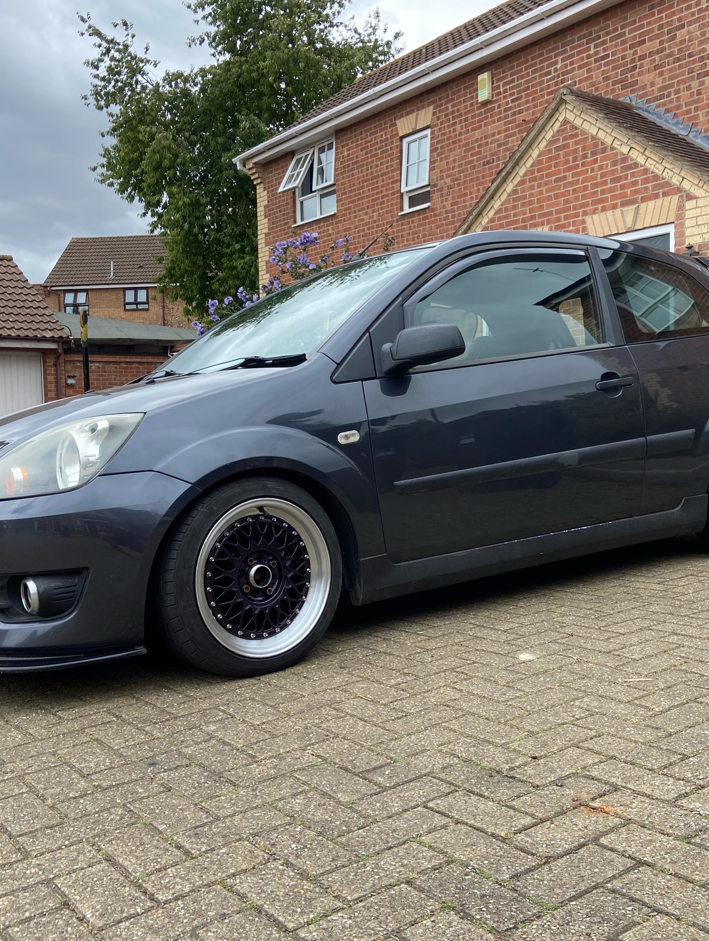Ford Fiesta with freshly sprayed rainbow glitter BBS-style alloy wheels fitted