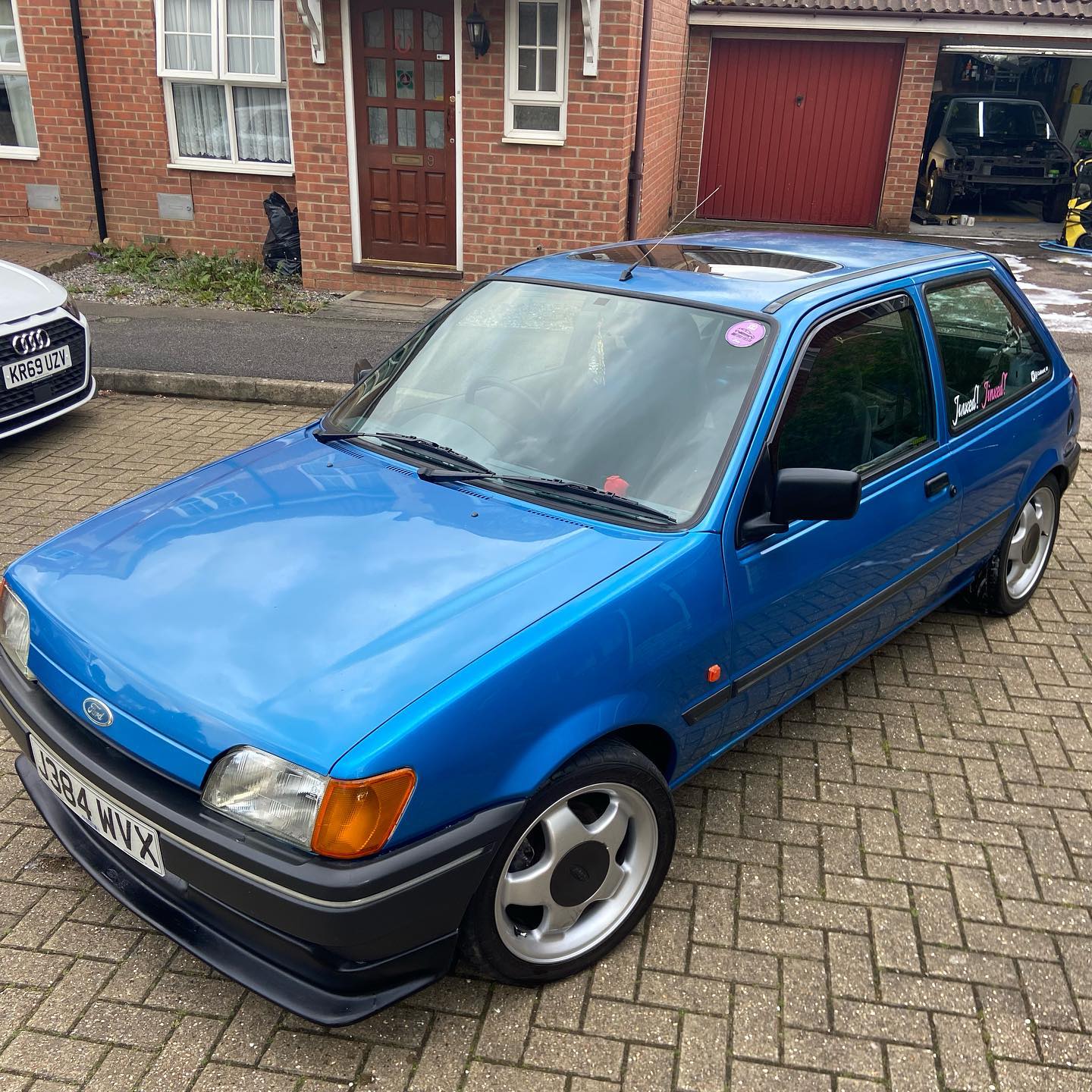 Classic blue Ford Fiesta Mk3 lowered on period alloys — retro Ford owned by Alex Cox